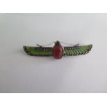 An Art Deco Egyptian revival high grade silver winged Scarab brooch, body formed by a carved