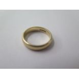 A hallmarked 9ct yellow gold band ring, size R, approx 5.3 grams, some marks consistent with use but