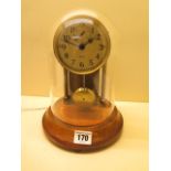 A Barr Electric clock under glass dome, 25cm tall, in working order