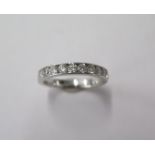 A very good quality diamond three quarter ring set in white gold with 1.0ct diamonds, size N, marked
