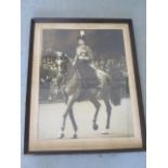 A large framed photographic print of Queen Elizabeth Trooping the Colour, possibly 1953, frame