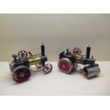 A Mamod steam roller and a traction engine, both unboxed