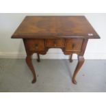 A walnut Queen Anne style three drawer lowboy side table, 71cm tall x 69cm x 45cm, with a good