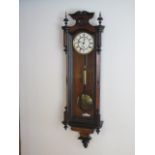 A 19th century Vienna single weight wall clock, 118cm tall, running