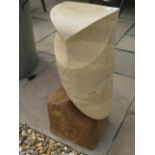 A hand carved stylised Owl sculpture, carved from Clipsham limestone by a Cambridgeshire based stone