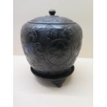 A 19th century bronze Japanese jar and cover with a matching stand decorated with three large and