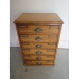 An oak 6 drawer collectors cabinet, 46cm tall x 32cm x 24cm, with a good light oak colour
