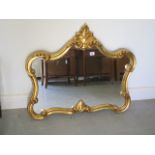 A modern ornate gilt mirror, 70cm tall x 80cm wide, in good condition
