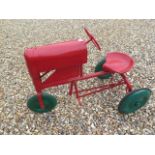 A Tri-ang 3 wheel tinplate pedal tractor, 67cm tall x 96cm long, in working order, repainted