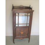 A late Victorian / Edwardian inlaid rosewood mirror fronted cabinet with a shelved interior, 117cm