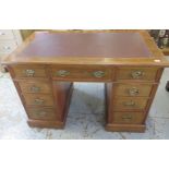 A late Victorian / Edwardian twin pedestal 9 drawer writing desk with leatherette inset top, 76cm