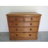 A Victorian stripped pine 5 drawer chest, 97cm tall x 105cm x 49cm