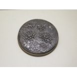 A Japanese 20th century metal cosmetic box and cover decorated with a chrysanthemum design, 12cm