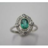 A pretty platinum emerald and diamond ring, size N, head 13mm x 11mm, diamonds bright