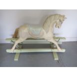 A painted carved wooden Rocking Horse, possibly an adapted fairground carousel horse, 92cm tall x