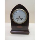 An inlaid mahogany lancet striking mantle clock, 25cm tall, generally good, small chips to dial,