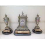 A good 19th century French silvered and gilt metal chinoiserie decorated clock garniture set with