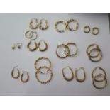 Twelve pairs of 9ct gold earrings approx 20 grams and 8 pairs of gilt earrings, approx weight 8.4