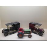 A tinplate clockwork tractor, 22cm long, and two tinplate static