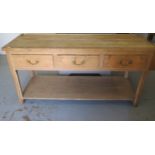 A Georgian stripped pine dresser base with three drawers above a pot board on square chamfered legs,