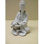 A blanc de chine seated figure, impressed mark to base, 12cm tall, good condition