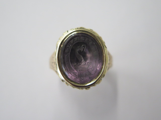 A Georgian / Victorian (9ct gold tested) amethyst intaglio seal ring, reshanked, size S, approx 10
