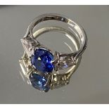 A stunning platinum oval sapphire and pear shaped diamond three stone ring brought from Asprey &