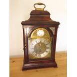 A flame mahogany bracket clock with movement, the dial signed Bradley London, with date aperture,