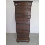 A hardwood collectors 15 drawer chest, 140cm tall x 50cm x 42cm