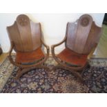 A pair of early 20th century oak Abbots style chairs with leather seats, 93cm tall x 60cm wide, seat