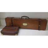 A pigskin tan leather brass cornered shotgun motoring case, 81cm long, in good polished condition