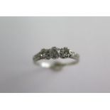 An 18ct white gold and platinum three stone diamond ring, size O/P, approx 2 grams, some general