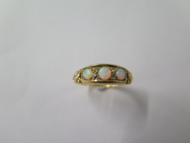 An 18ct yellow gold opal ring, size O, approx 3.2 grams, generally good