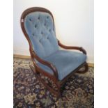 A Victorian mahogany button back rocking chair, 98cm tall