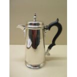 A silver water jug, 17cm tall, approx 10.3 troy oz, minor dents, hallmarks worn