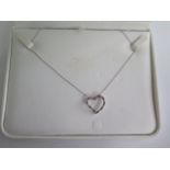 A 14ct white gold pink sapphire diamond heart shape pendant, 22mm diameter, with a 14ct white gold