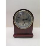 An 8 day mahogany mantle clock, 22cm tall, running