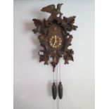 A German double weight Cuckoo clock, 49cm tall, working order