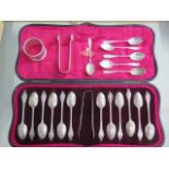 A boxed set of 12 silver teaspoons with sugar nip, London GJ/DF 1904, and six silver coffee spoons