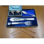 A silver salt set boxed, 2 silver nips, a silver spoon and a plated serving set boxed, total