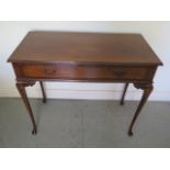 A circa 1930s walnut side table desk with single frieze drawer on slender cabriole legs, in good