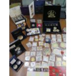 A collection of assorted coins and tokens including a 2002 executive proof set, Famous US coin