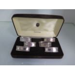 A set of 6 silver napkin rings, 2 engraved, total weight approx 1.5 troy oz