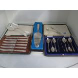 A boxed set of 6 silver apostle spoons with nip, a pair of silver serving spoons, a pair of silver