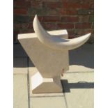 A hand carved abstract bull, made from limestone, made by a Cambridgeshire based stone carver,