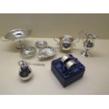 An assortment of table silver, a weighted presentation dish on stand, 3 small dishes, a sugar bowl