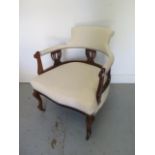 An Edwardian beechwood upholstered open armchair in good condition, 74cm tall x 64cm wide x 61cm