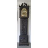 An impressive carved oak 8 day three train longcase clock, quarter chiming on eight bells and