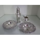 A pair of silver bon bon dishes, a silver caster and a silver jug, total weight approx 9.4 troy oz