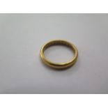 A hallmarked 22ct yellow gold band ring, size K, approx 4.2 grams, some general usage marks